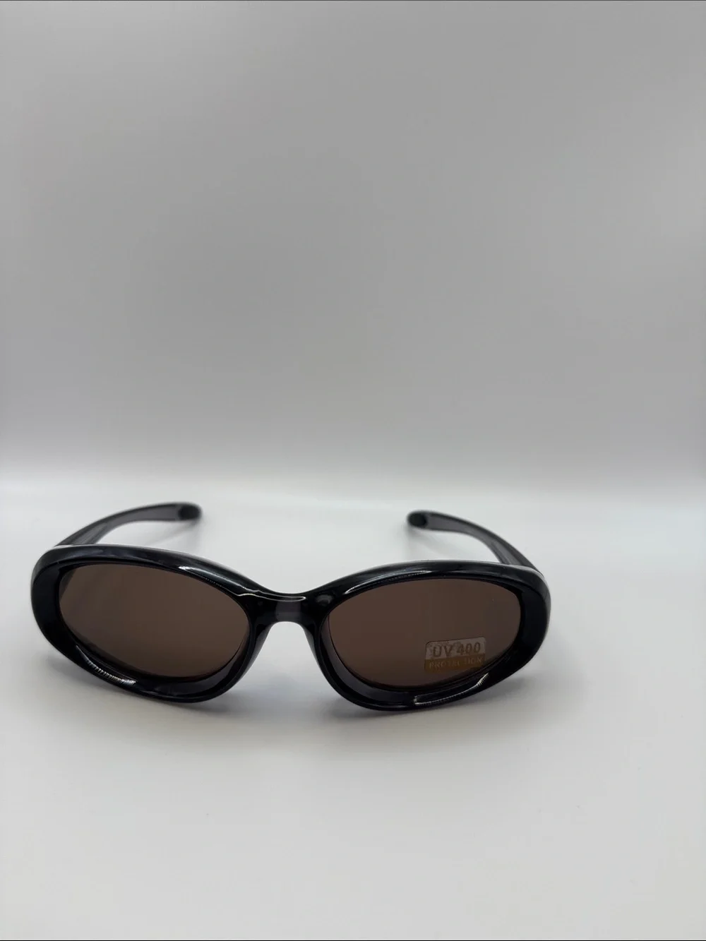 Women's Black Oval Sunglasses with Brown Lenses - UV400 Protection